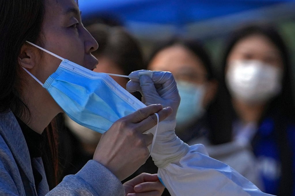 A woman receiving a Covid-19 test. The pandemic has not been the only source of anxiety. Hong Kong saw months of civil unrest in 2019 and the introduction of a new security law in 2020. Photo: AP
