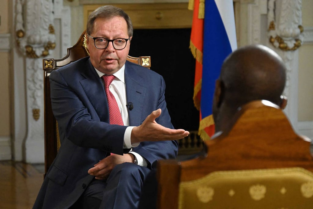 Russian Ambassador to Britain, Andrei Kelin, with BBC journalist Clive Myrie. Photo: AFP