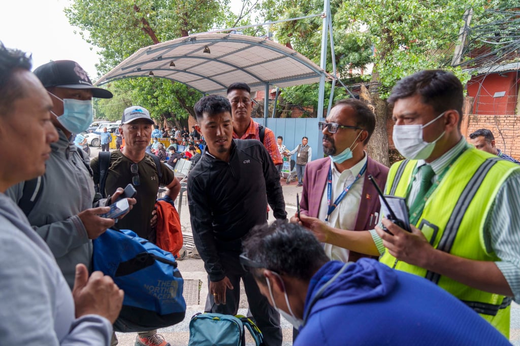 A team of climbers prepare for rescue operations in Nepal on Sunday after a small plane with 22 people on board went missing in the mountains. Photo: AP