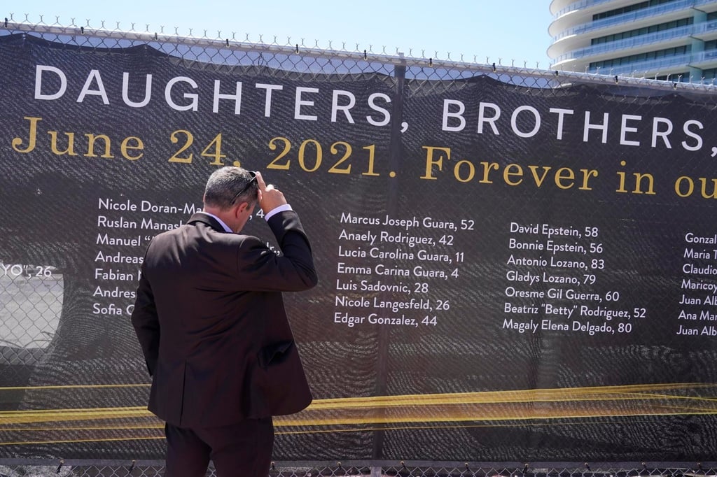A banner with the names of the 98 people who were killed in the collapse of the Champlain Towers South building in Surfside, Florida, US. Photo: AP