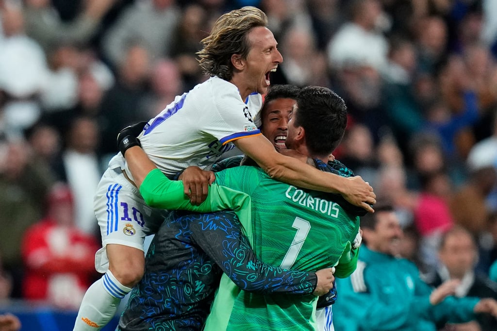 Real Madrid’s goalkeeper Thibaut Courtois, right, celebrates with Real Madrid’s Luka Modric after the Champions League final between Liverpool and Real Madrid at the Stade de France in Saint Denis near Paris on May 28. Photo: AP