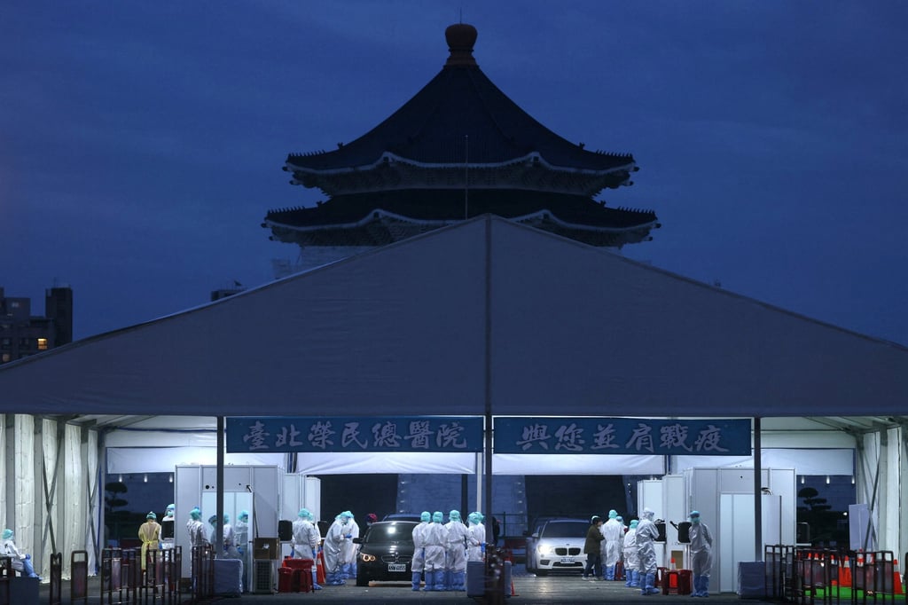People wait to get tested at a drive-through site at Liberty Square in Taipei. Photo: Reuters People wait to get tested at a drive-through site at Liberty Square in Taipei. Photo: Reuters