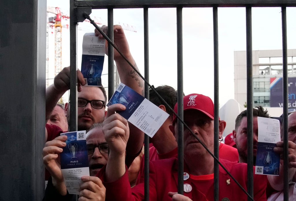 Fans shows tickets in front of the Stade de France before the Champions League final football match between Liverpool and Real Madrid in Saint Denis near Paris on Saturday. Photo: AP