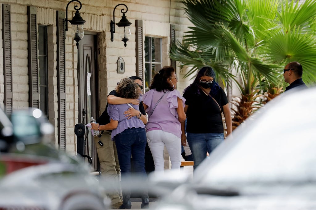 People comfort each other at the entrance of the funeral home where lies Amerie Jo Garza, one of the victims of the Robb Elementary school shooting, in Uvalde, Texas on Tuesday. Photo: Reuters People comfort each other at the entrance of the funeral home where lies Amerie Jo Garza, one of the victims of the Robb Elementary school shooting, in Uvalde, Texas on Tuesday. Photo: Reuters