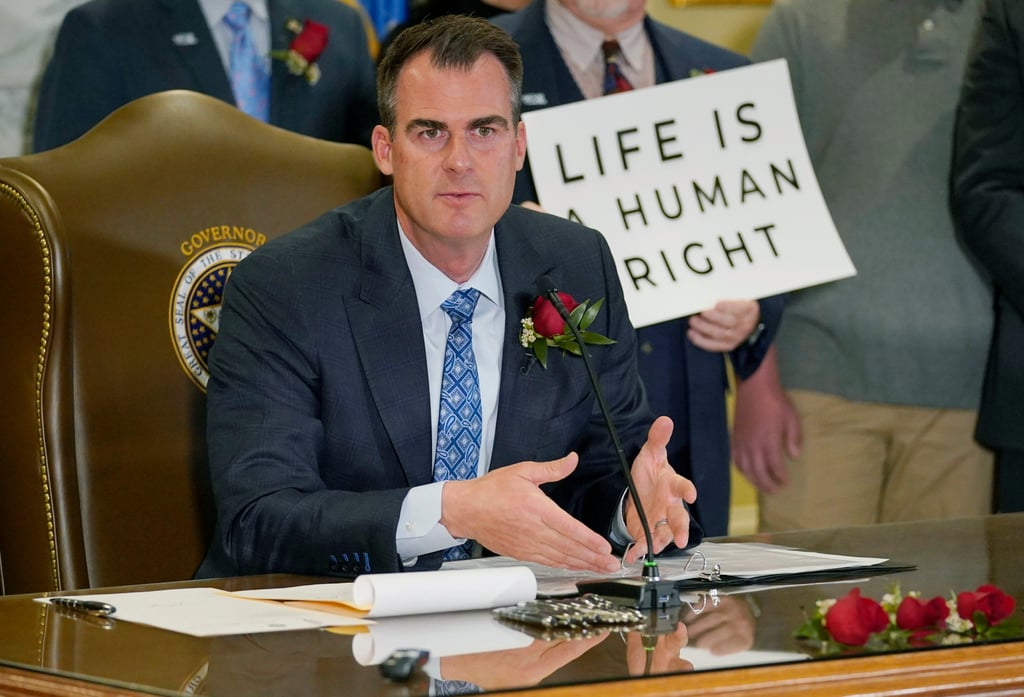 Oklahoma Governor Kevin Stitt speaks after signing into law a bill making it a felony to perform an abortion, punishable by up to 10 years in prison, on April 12 in Oklahoma City. State lawmakers have approved a ban on abortion enforced by civil lawsuits rather than criminal prosecution, similar to a Texas law that was passed last year. Photo: AP Photo Oklahoma Governor Kevin Stitt speaks after signing into law a bill making it a felony to perform an abortion, punishable by up to 10 years in prison, on April 12 in Oklahoma City. State lawmakers have approved a ban on abortion enforced by civil lawsuits rather than criminal prosecution, similar to a Texas law that was passed last year. Photo: AP Photo