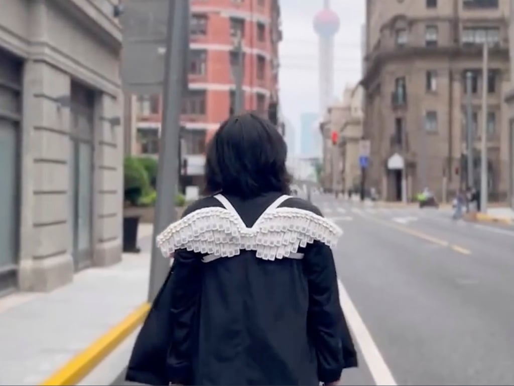 Han and his artist girlfriend Wu said they were inspired to create the wings by the city’s endurance during lockdown. Photo: The Cover Han and his artist girlfriend Wu said they were inspired to create the wings by the city’s endurance during lockdown. Photo: The Cover