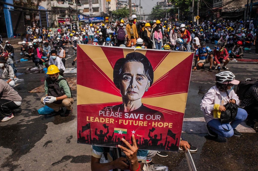 A protester holds a poster featuring detained civilian leader Aung San Suu Kyi during a demonstration against the military coup in Yangon. File photo: AFP