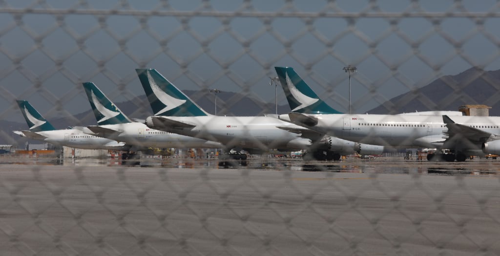 Cathay Pacific planes are seen parked at Hong Kong International Airport. Economic-class tickets from the city to London later this month cost as much as US$5,360. Photo: Yik Yeung -man