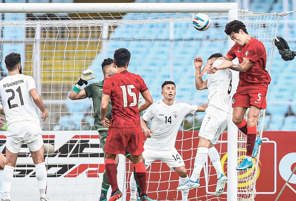 Sean Tse above Afghanistan midfielder Noor Husin to send a header towards goal during the first half of their Group D 2023 Asian Cup qualifier at the Vivekananda Yuba Bharati Krirangan Stadium in Kolkata. Photo: HKFA Sean Tse above Afghanistan midfielder Noor Husin to send a header towards goal during the first half of their Group D 2023 Asian Cup qualifier at the Vivekananda Yuba Bharati Krirangan Stadium in Kolkata. Photo: HKFA