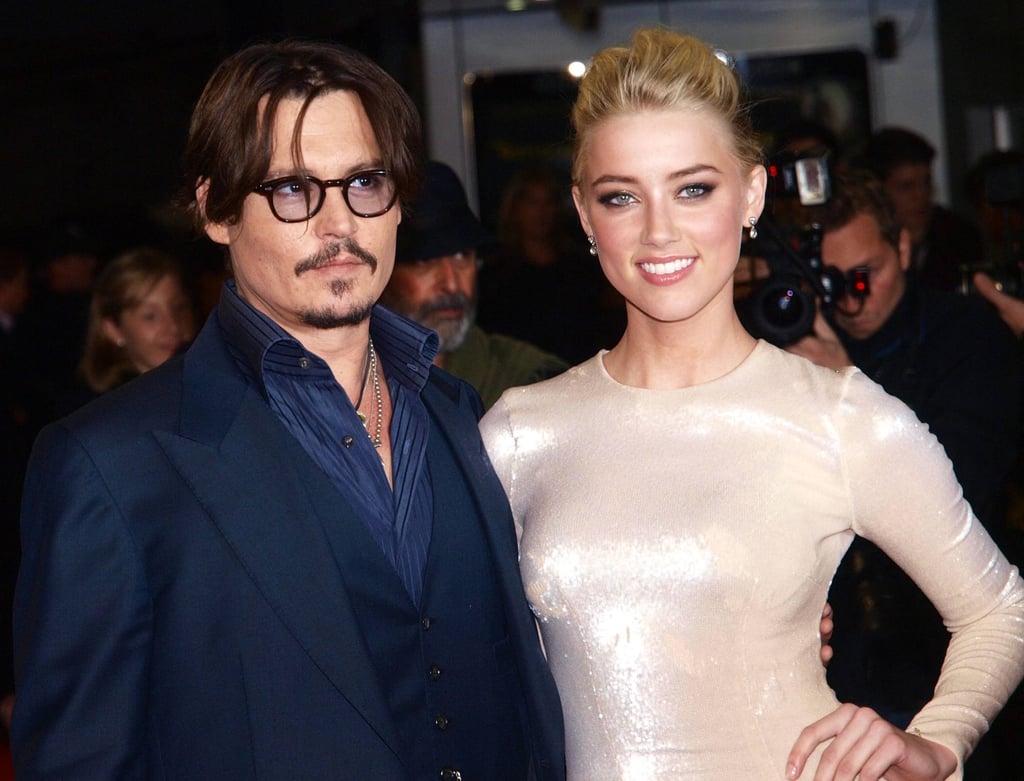 Johnny Depp and Amber Heard seen in 2011 at the European premiere of their film The Rum Diary. Photo: AFP Johnny Depp and Amber Heard seen in 2011 at the European premiere of their film The Rum Diary. Photo: AFP