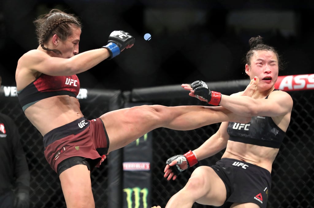 Zhang Weili of China gets kicked by Joanna Jedrzejczyk of Poland during UFC 248. Photo: Las Vegas Sun via AP