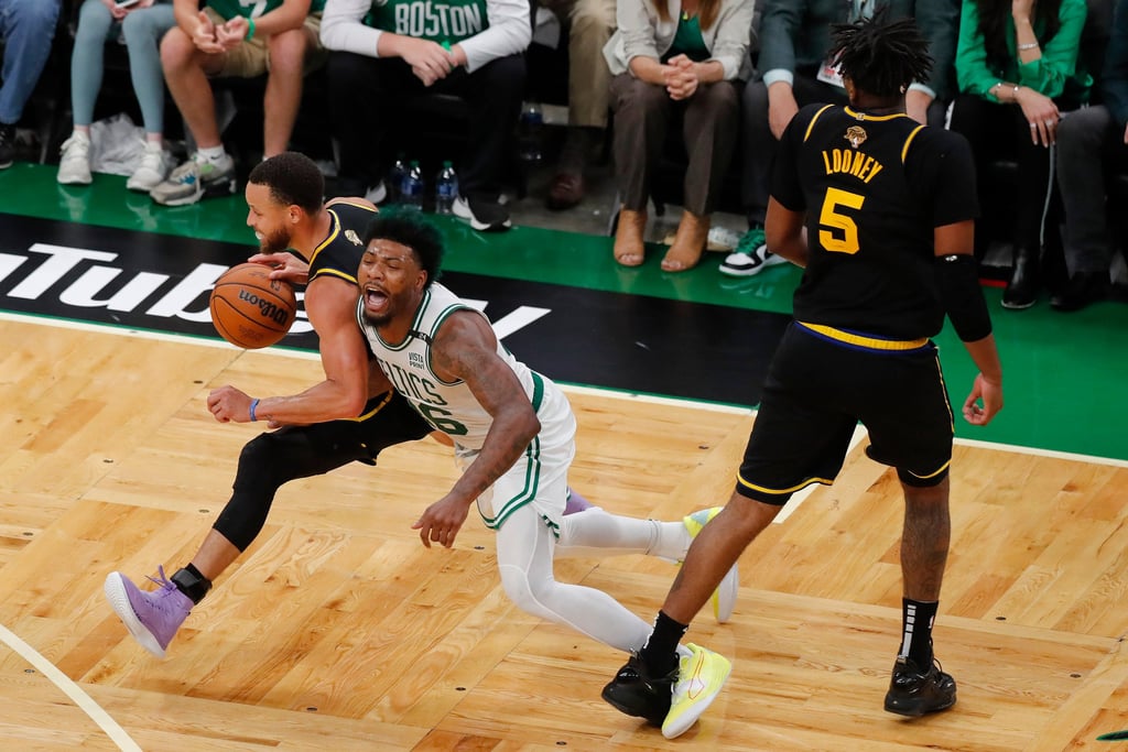 Stephen Curry drives against Boston Celtics guard Marcus Smart during the fourth quarter of Game 4. Photo: AP Stephen Curry drives against Boston Celtics guard Marcus Smart during the fourth quarter of Game 4. Photo: AP