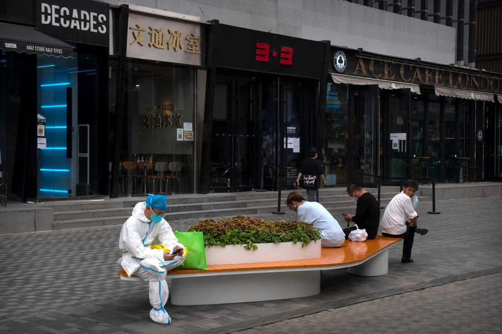 A mostly deserted pedestrian shopping street in Beijing. Photo: AP