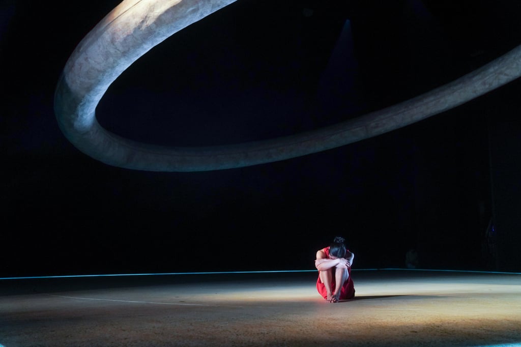 Ong Tsz Shen as Nezha, in despair after his father’s rejection. Jan Wong’s inspired set consists of a massive hollow circle suspended above the stage. Photo: Mak Cheong-wai/Moon 9 images Ong Tsz Shen as Nezha, in despair after his father’s rejection. Jan Wong’s inspired set consists of a massive hollow circle suspended above the stage. Photo: Mak Cheong-wai/Moon 9 images