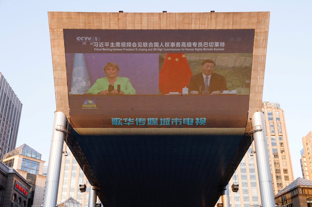 Chinese President Xi Jinping and the UN’s human rights chief Michelle Bachelet seen on a giant screen in Beijing last month broadcasting news of their virtual meeting. Photo: Reuters