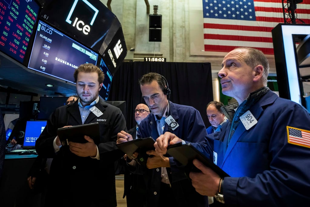 Traders work on the floor at the New York Stock Exchange on May 6 amid worries the Federal Reserve may cause a recession in its drive to stem inflation. Photo: NYSE via AP