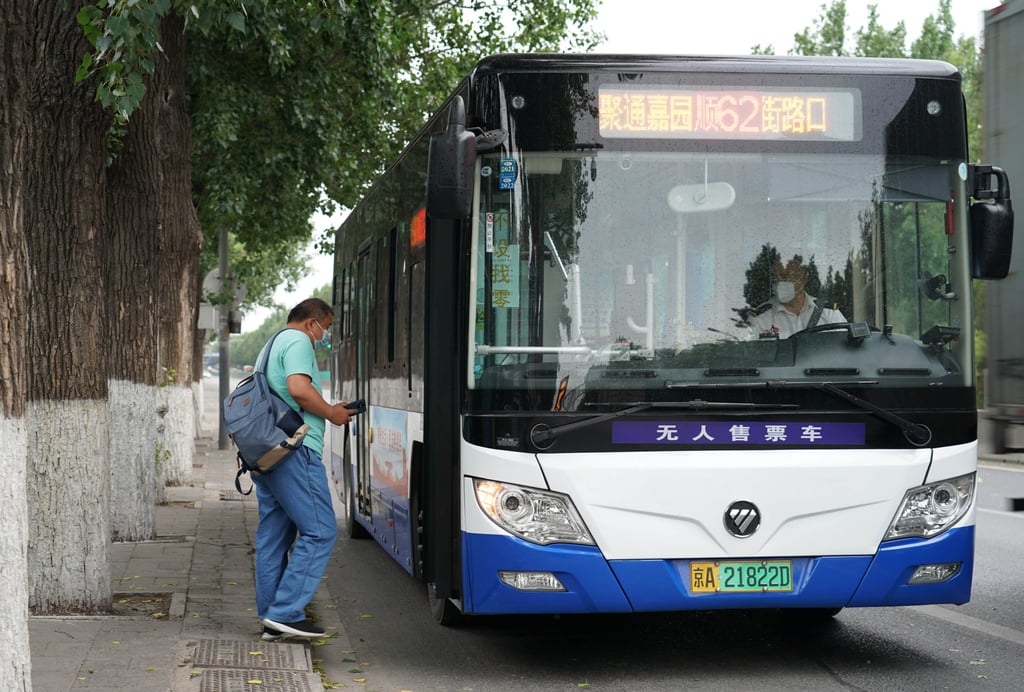 A man getting on a bus at a bus station in Shunyi District of Beijing which has been under varying degrees of Covid-19 lockdown. Photo: Xinhua