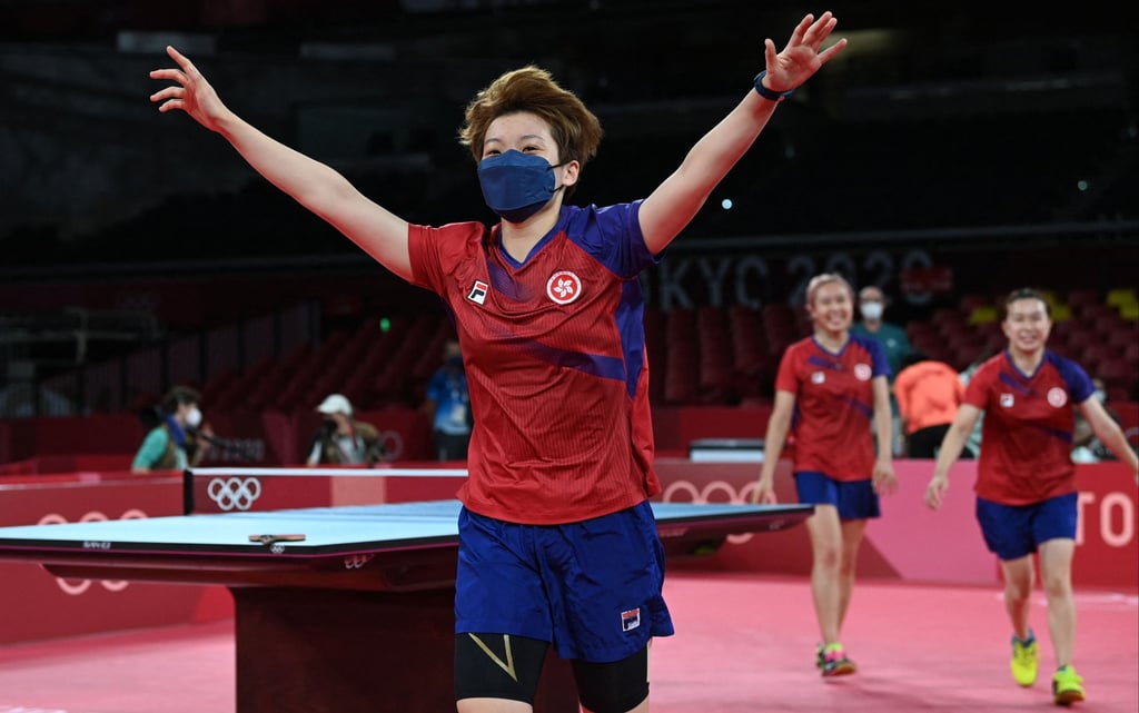 Hong Kong’s Doo Hoi-kem (left), Minnie Soo Wai-yam and Lee Ho-ching celebrate after winning the bronze medal in the women’s team table tennis event at the Tokyo Olympics. Photo: AFP Hong Kong’s Doo Hoi-kem (left), Minnie Soo Wai-yam and Lee Ho-ching celebrate after winning the bronze medal in the women’s team table tennis event at the Tokyo Olympics. Photo: AFP