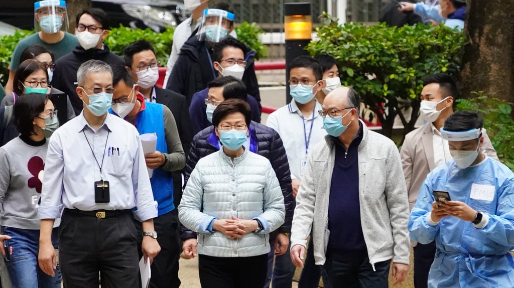 Carrie Lam (centre) visits the Kwai Chung Estate as residents undergo a five-day lockdown during the fifth wave of the pandemic on January 23. Photo: Felix Wong