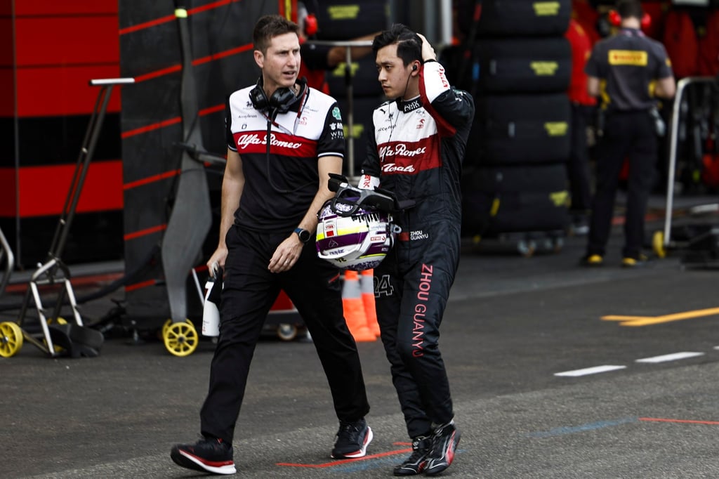 Alfa Romeo’s Zhou Guanyu (right) walks along the pit lane in Baku. Photo: EPA-EFE