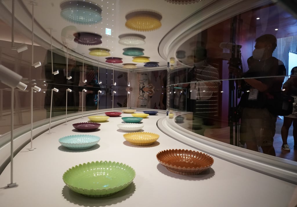 A view of 12 chrysanthemum-shaped dishes from the Qing dynasty featured in “Clay to Treasure: Chinese Ceramics from the Palace Museum”, one of the nine inaugural exhibitions at the Hong Kong Palace Museum opening on July 2, 2022. Photo: Felix Wong