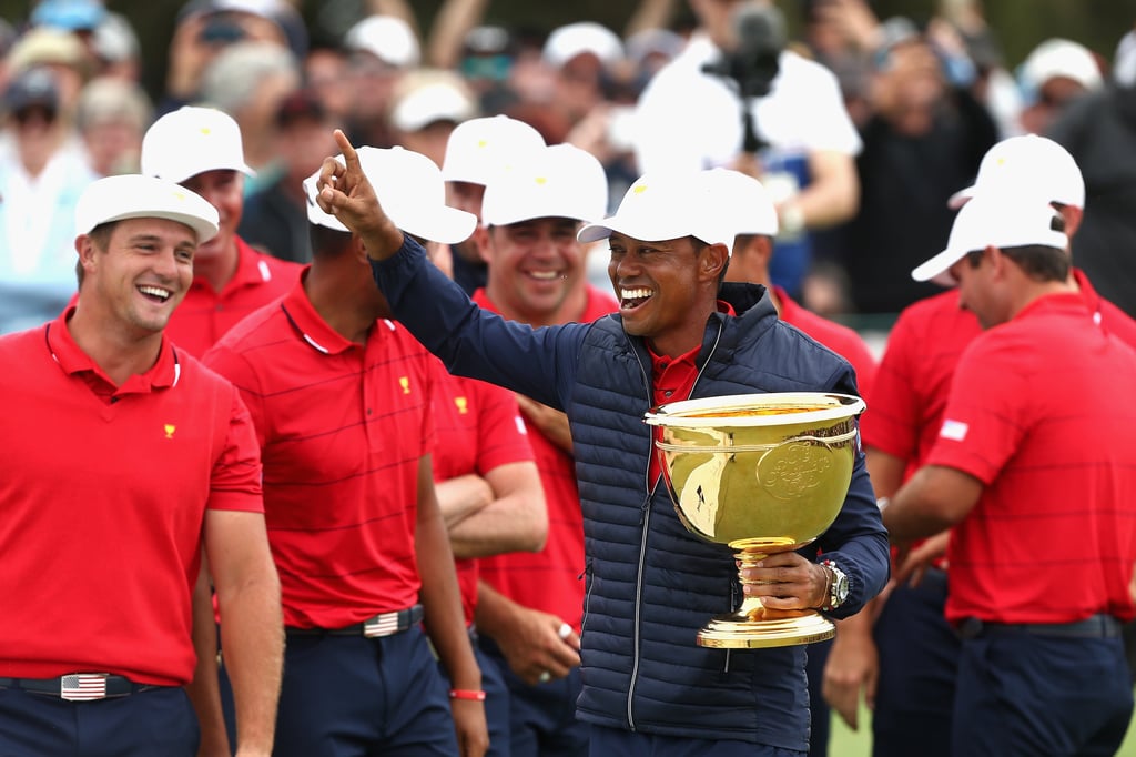 Tiger Woods, captain of the US golf team, celebrates with the trophy after winning the Sunday singles matches on day four of the 2019 Presidents Cup golf competition at the Royal Melbourne Golf Club. Photo: AAP/DPA Tiger Woods, captain of the US golf team, celebrates with the trophy after winning the Sunday singles matches on day four of the 2019 Presidents Cup golf competition at the Royal Melbourne Golf Club. Photo: AAP/DPA