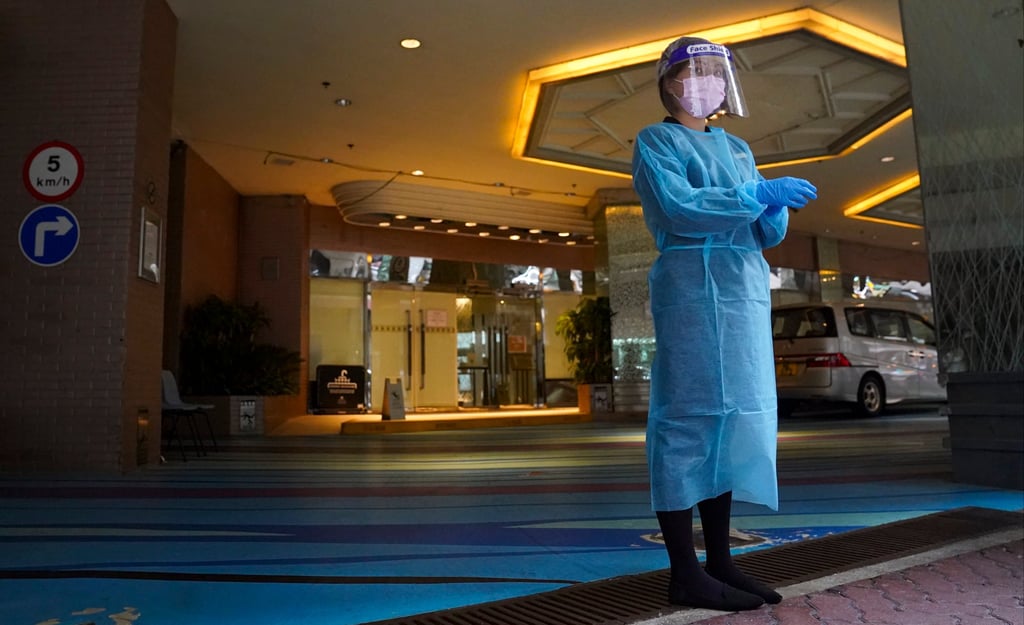 A healthcare worker at the foyer of a designated quarantine hotel in Kowloon City. Photo: Sam Tsang A healthcare worker at the foyer of a designated quarantine hotel in Kowloon City. Photo: Sam Tsang