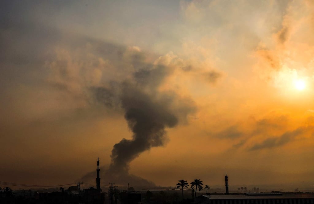 Fire erupts following an Israeli air strike south of Gaza City on Saturday. Photo: AFP