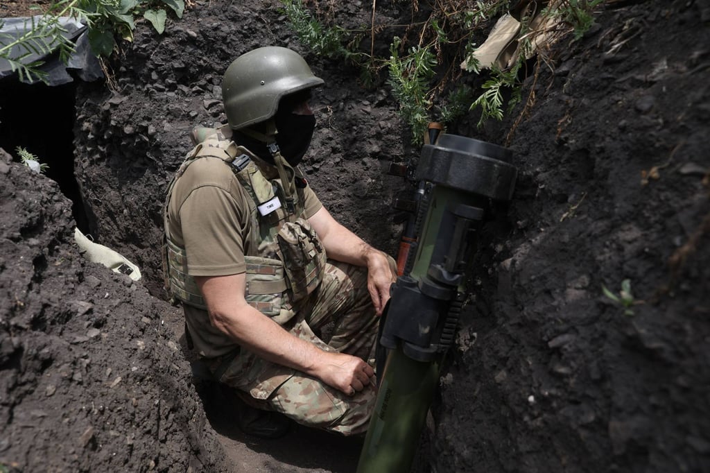A Ukrainian serviceman mans a position in a trench on the front line near Avdiivka, Donetsk region on Saturday. Photo: AFP