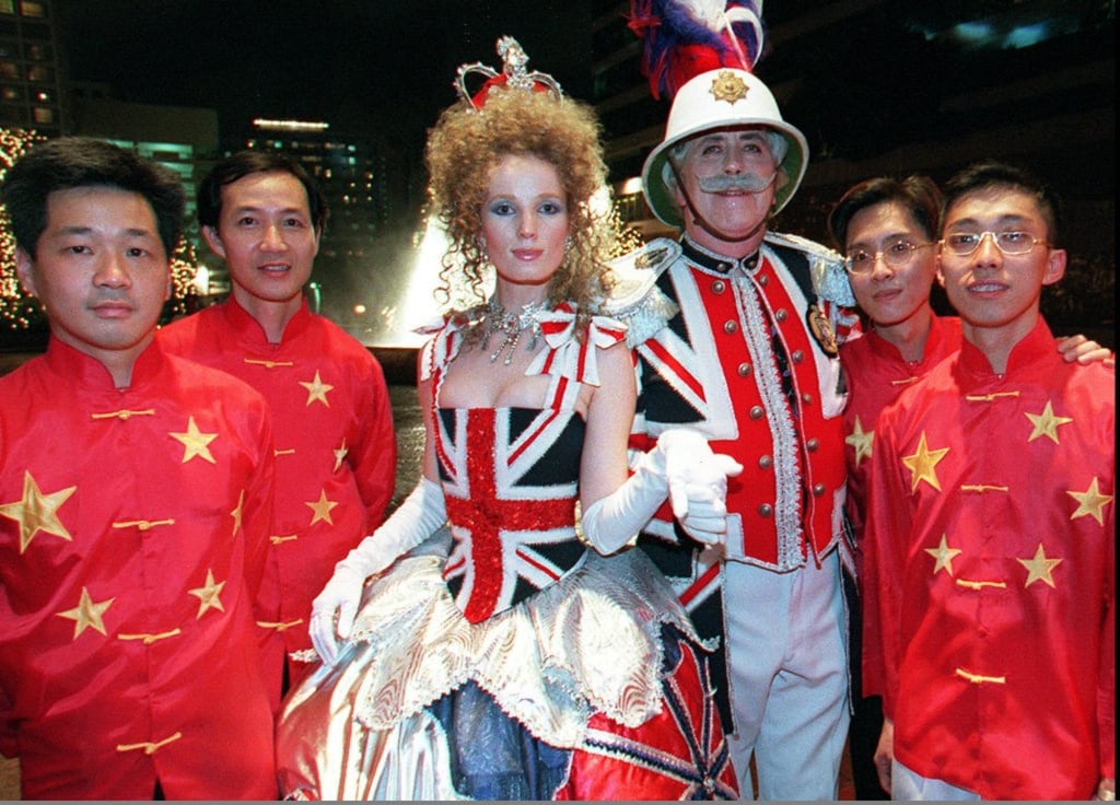 Revellers attend a handover party dressed in clothing depicting British and Chinese national colours at the Regent hotel in Kowloon on July 1, 1997. Photo: AFP