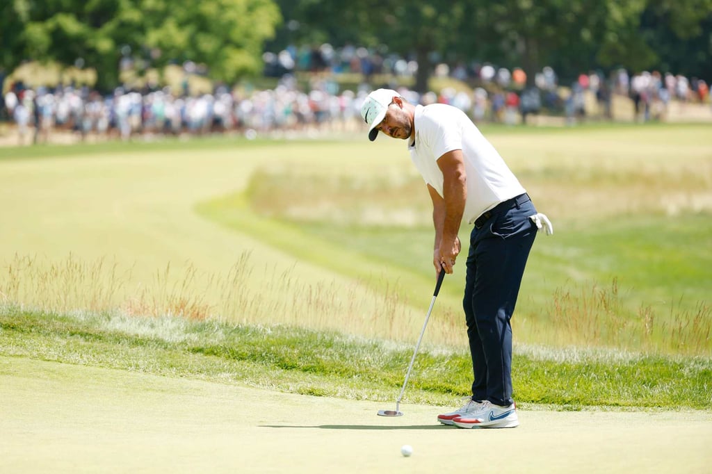 Brooks Koepka putts on the 18th green during the second round of the US Open. Photo: AFP