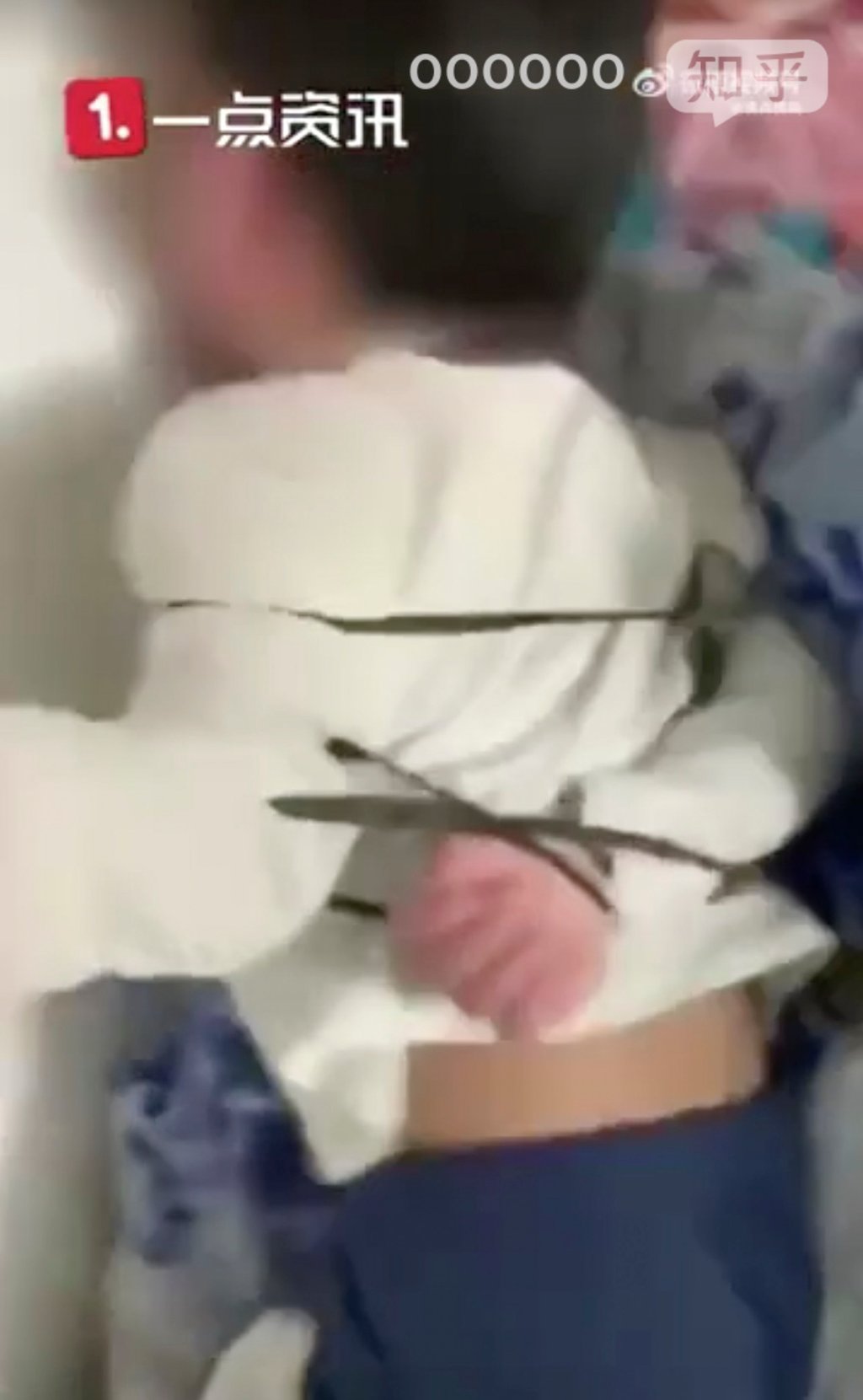 One of the children was video taped lying in bed with his hands tied behind his back. Photo: Zihu.com