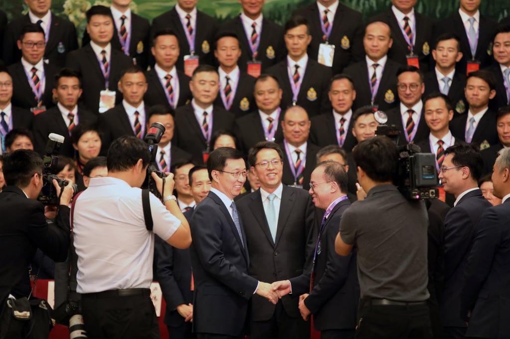 Zhang Xiaoming (centre), the director of the Hong Kong and Macau Affairs Office at the time, and Chinese Vice-Premier Han Zheng (centre left) meet a delegation of the disciplined services from Hong Kong. Photo: Simon Song