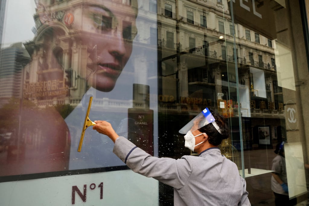 A worker cleans the facade of a Chanel store in Shanghai. Fashion and beauty retailers are looking to clear a mountain of unsold stock following Covid-19 lockdowns that have left shoppers nervous. Photo: Reuters A worker cleans the facade of a Chanel store in Shanghai. Fashion and beauty retailers are looking to clear a mountain of unsold stock following Covid-19 lockdowns that have left shoppers nervous. Photo: Reuters