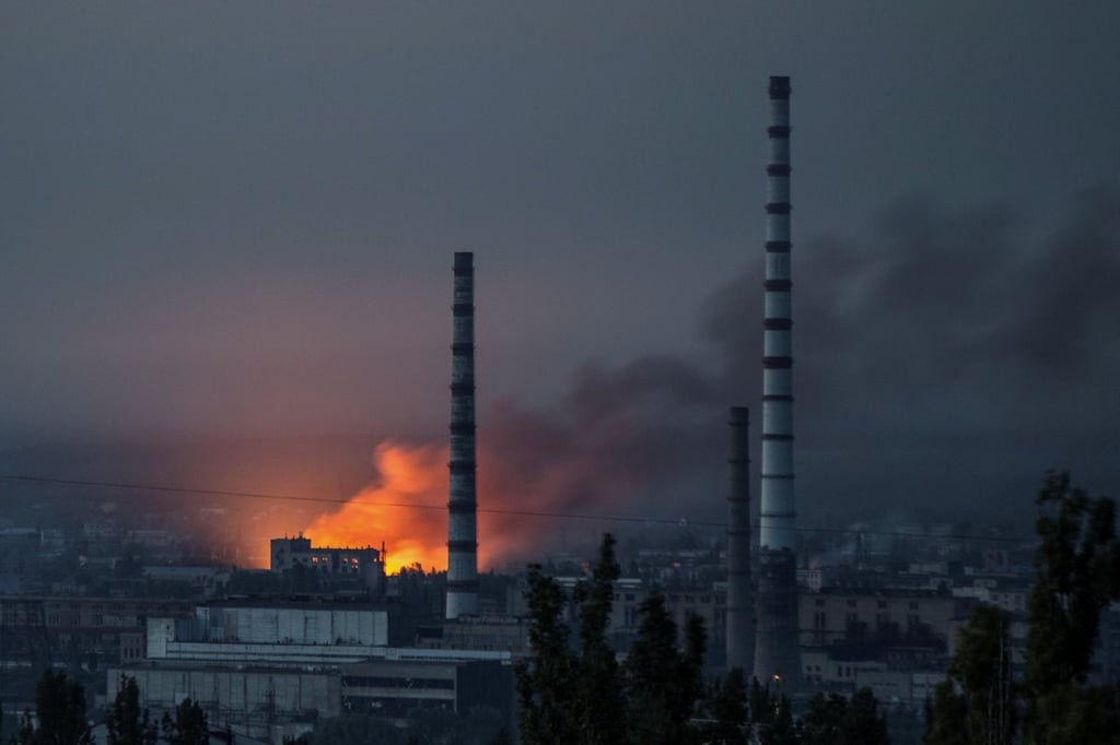 Smoke and flames rise after a military strike on a compound of Sievierodonetsk’s Azot chemical plant last week. Photo: Reuters Smoke and flames rise after a military strike on a compound of Sievierodonetsk’s Azot chemical plant last week. Photo: Reuters