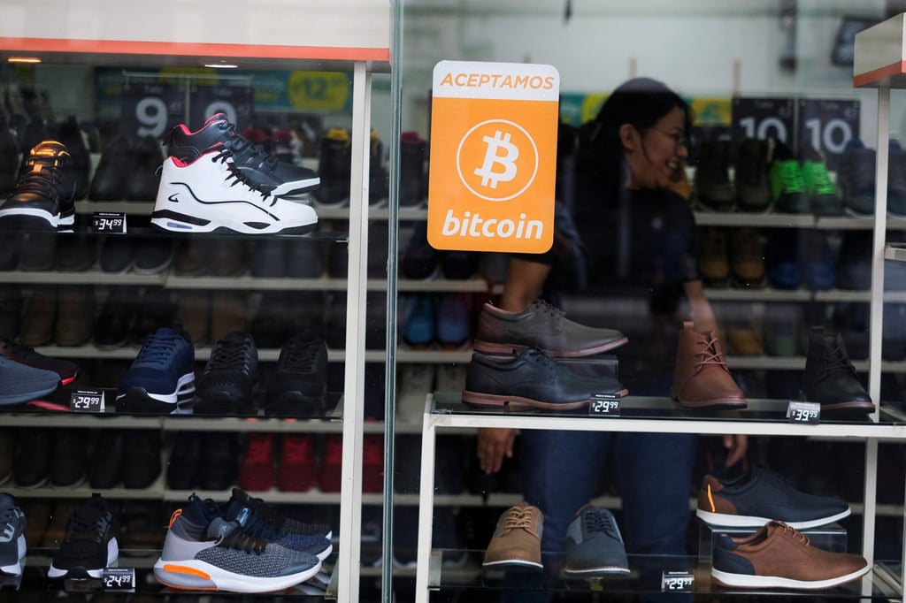 A bitcoin sign is displayed outside a store where the cryptocurrency is accepted as a payment method in San Salvador, El Salvador. Photo: Reuters A bitcoin sign is displayed outside a store where the cryptocurrency is accepted as a payment method in San Salvador, El Salvador. Photo: Reuters