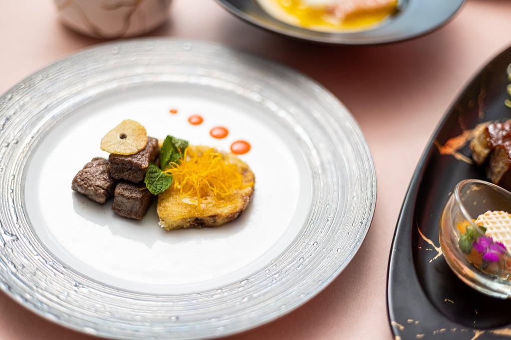 Above and Beyond’s pan-fried foie gras with rose dressing served with wok-fried Wagyu beef cubes. Photo: Handout Above and Beyond’s pan-fried foie gras with rose dressing served with wok-fried Wagyu beef cubes. Photo: Handout