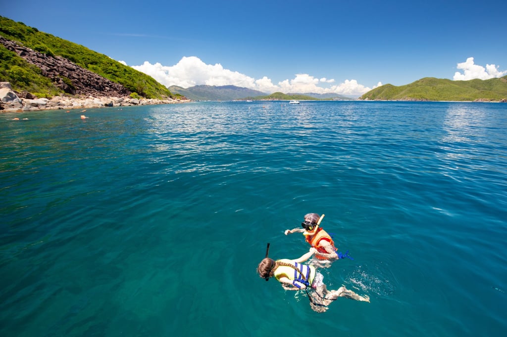 Two people snorkel off the island of Hon Mun near Nha Trang in Vietnam. Photo: Shutterstock Two people snorkel off the island of Hon Mun near Nha Trang in Vietnam. Photo: Shutterstock