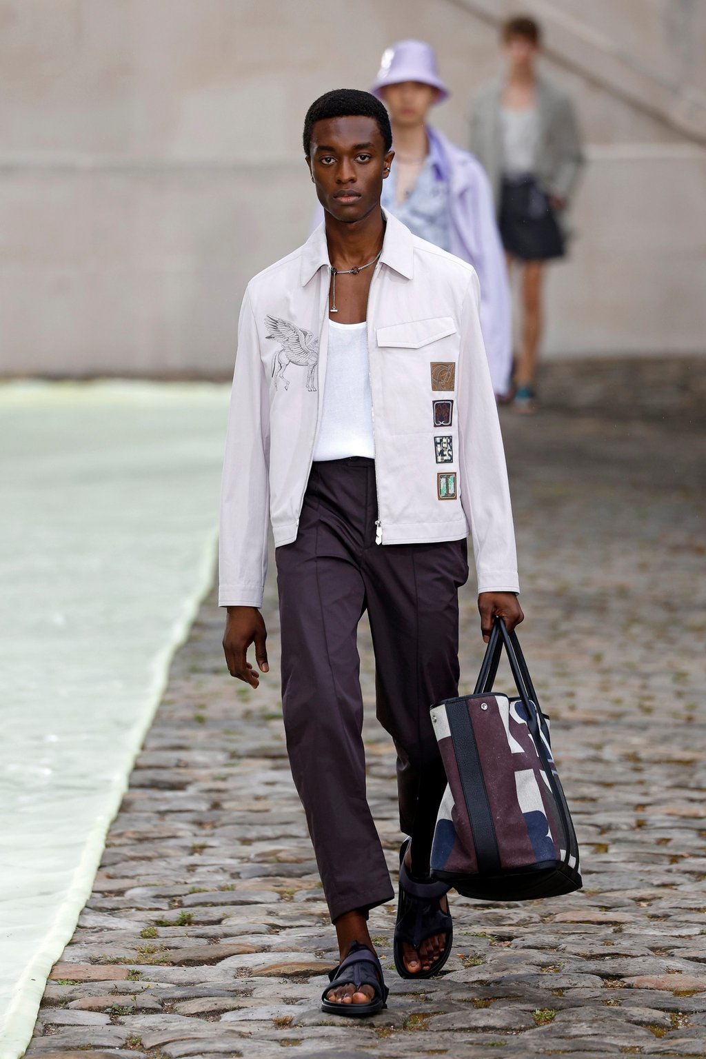 Hermès menswear spring/summer 2023 collection, presented at the men’s fashion week in Paris, France, on June 25, featured minimalist looks aplenty. Photo: Xinhua Hermès menswear spring/summer 2023 collection, presented at the men’s fashion week in Paris, France, on June 25, featured minimalist looks aplenty. Photo: Xinhua