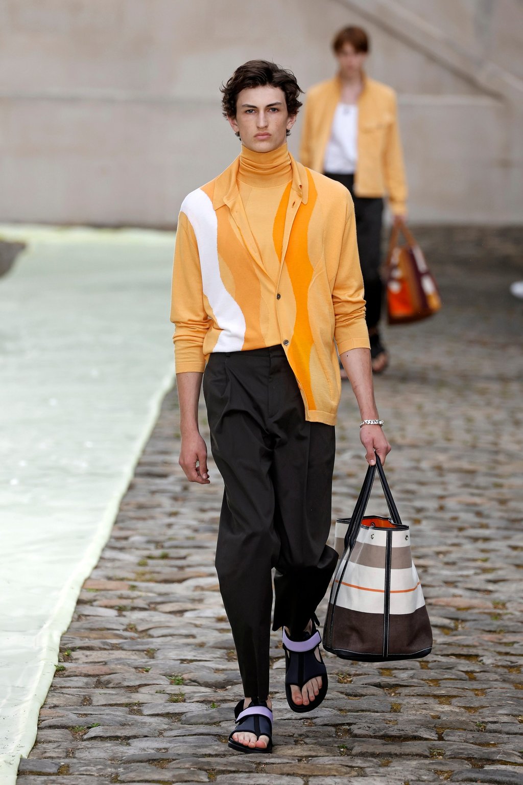 Outfits featuring vibrant jackets and travel bags brought a summer holiday vibe at Hermès’ spring/summer 2023 collection during the men’s fashion week in Paris, France, on June 25. Photo: Xinhua Outfits featuring vibrant jackets and travel bags brought a summer holiday vibe at Hermès’ spring/summer 2023 collection during the men’s fashion week in Paris, France, on June 25. Photo: Xinhua