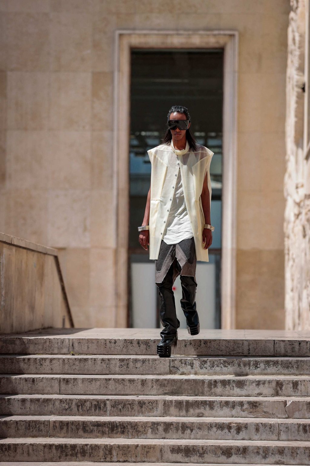 A sheer white tunic is layered over a white shirt and dark hued pants at Rick Owens’ menswear spring/summer 2023 show, as part of Paris Fashion Week, in Paris, on June 23. Photo: AFP