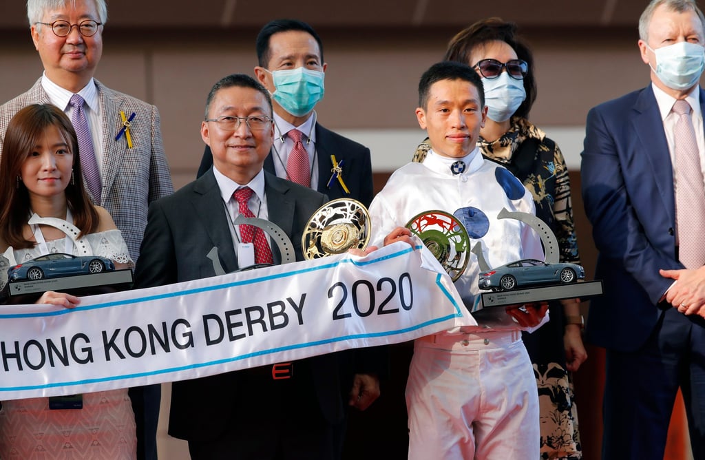 Trainer Francis Lui (centre left) celebrates with jockey Vincent Ho after Golden Sixty wins the BMW Hong Kong Derby at Sha Tin Racecourse in March 2020. Photo: SCMP