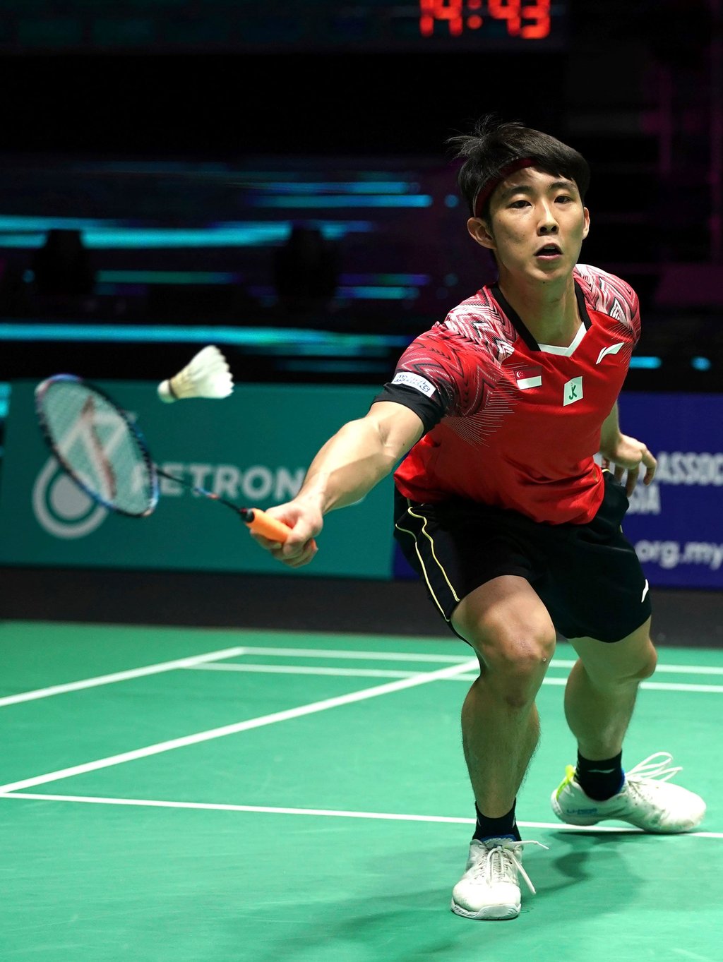 Singapore’s Loh Kean Yew plays a shot against Hong Kong’s Lee Cheuk Yiu during their men’s singles first round match at the Malaysia Open at Axiata Arena in Kuala Lumpur on June 28, 2022. Photo: AP