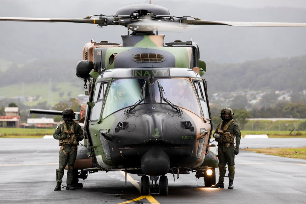 Naval aircrew stand beside a Taipan helicopter in Wollongong, Australia, last year. Australia’s military said it plans to replace the aircraft with the more reliable US-made Black Hawks and Seahawks. Photo: Corporal Kylie Gibson/Australian Department of Defence via AP Naval aircrew stand beside a Taipan helicopter in Wollongong, Australia, last year. Australia’s military said it plans to replace the aircraft with the more reliable US-made Black Hawks and Seahawks. Photo: Corporal Kylie Gibson/Australian Department of Defence via AP