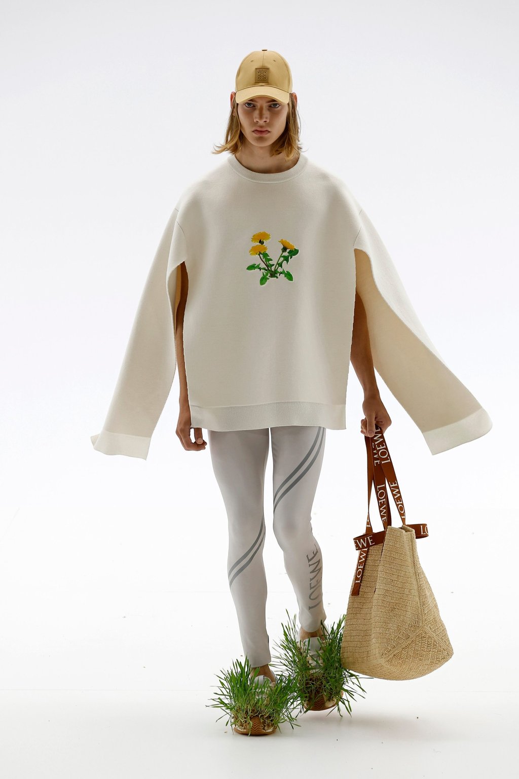 A minimalist jumper with flapping sleeves and a flower design layered over sports leggings for Loewe’s spring/summer 2023 collection during the men’s fashion week in Paris, France, on June 25. Photo: Xinhua