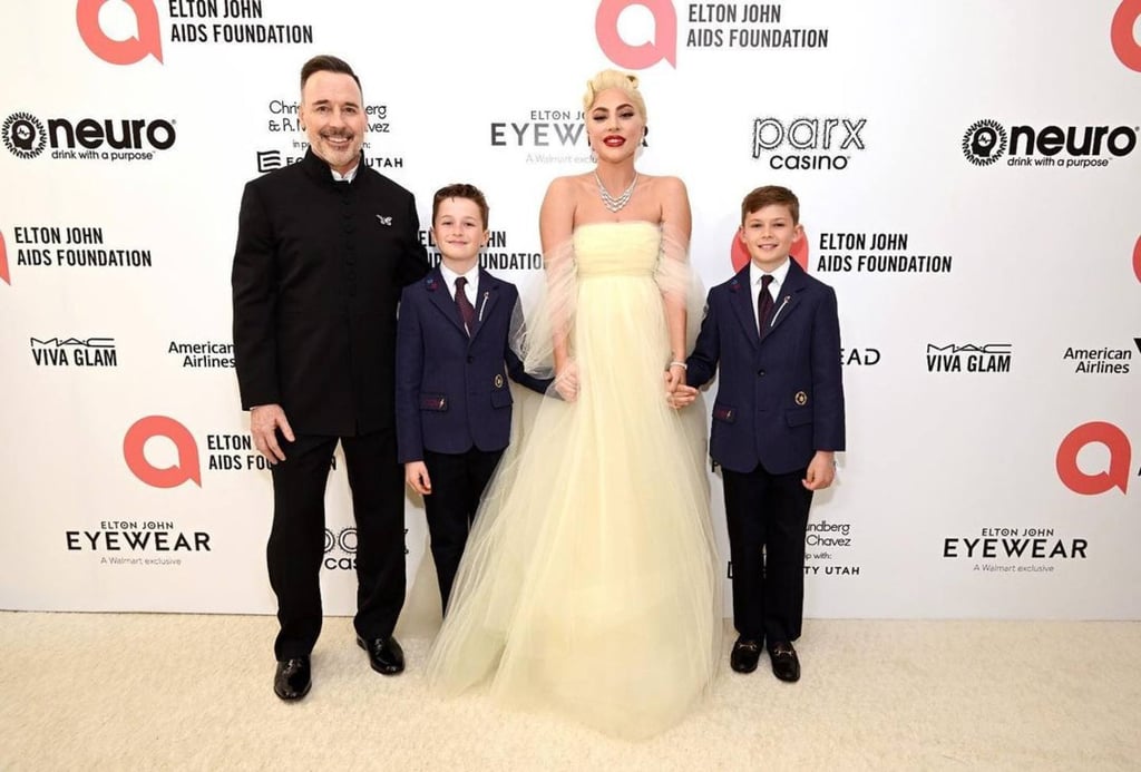 Fairy godmother glam: Lady Gaga with her godsons Zachary Jackson Levon Furnish-John and Elijah Joseph Daniel Furnish-John, and one of their dads, David Furnish. Photo: @davidfurnish/Instagram Fairy godmother glam: Lady Gaga with her godsons Zachary Jackson Levon Furnish-John and Elijah Joseph Daniel Furnish-John, and one of their dads, David Furnish. Photo: @davidfurnish/Instagram