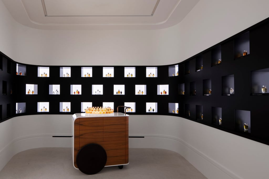 Upon entering, a modern black monogrammed island showcases a wealth of the house’s perfume collections.