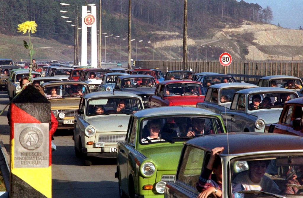 A column of Trabis crosses the border between East and West Germany in November 1989. The GDR opened its borders on November 9, 1989. Photo: Getty Images A column of Trabis crosses the border between East and West Germany in November 1989. The GDR opened its borders on November 9, 1989. Photo: Getty Images