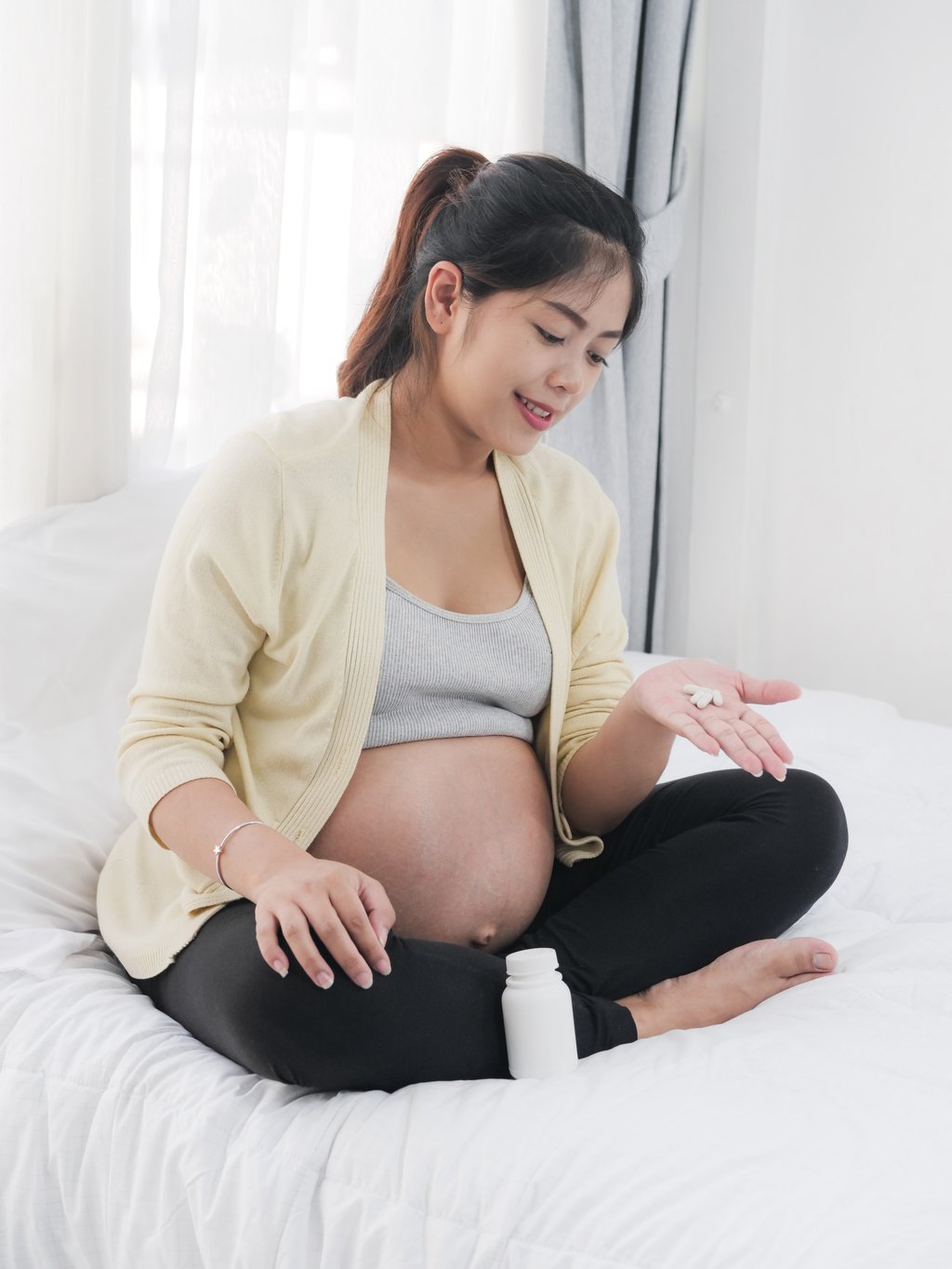 It may make more sense for pregnant women to take folic acid only, or eat more folic-acid-fortified cereal-grain products than prenatal vitamins. Photo: Shutterstock