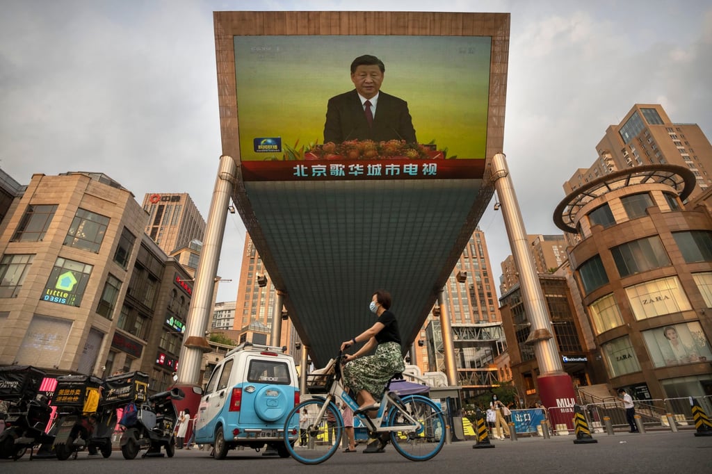 A large TV screen at a Beijing shopping centre beams coverage of President Xi Jinping’s visit to Hong Kong for its 25th handover anniversary on July 1. Photo: